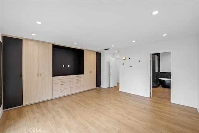 4801 Heaven Ave, Woodland Hills, CA 91364 - unfurnished living room featuring light wood-style floors and recessed lighting