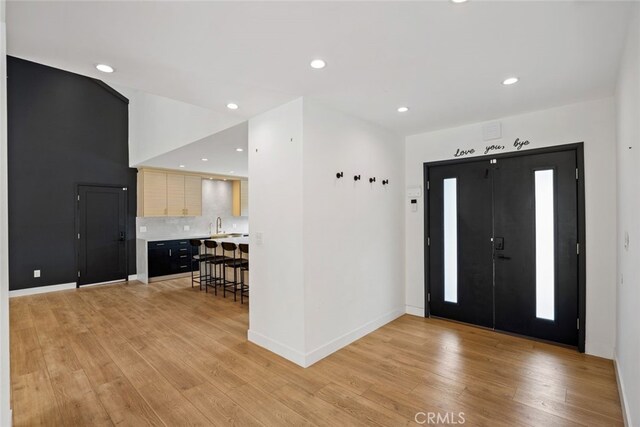 4801 Heaven Ave, Woodland Hills, CA 91364 - foyer entrance with light wood-style floors, recessed lighting, and baseboards