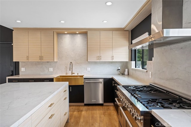 4801 Heaven Ave, Woodland Hills, CA 91364 - kitchen featuring stainless steel dishwasher, wall chimney range hood, stovetop, a sink, and light stone counters
