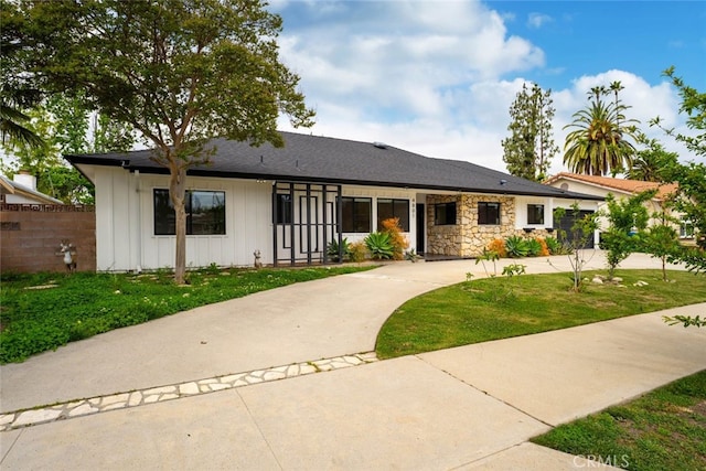 4801 Heaven Ave, Woodland Hills, CA 91364 - single story home with board and batten siding and stone siding