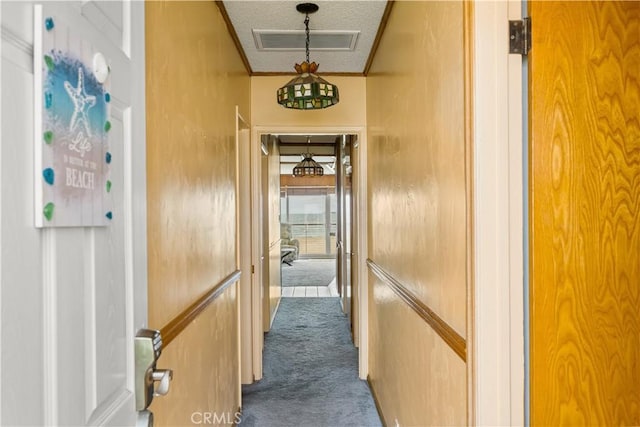 1207 Seal Way, Seal Beach, CA 90740 - corridor featuring dark colored carpet, a textured ceiling, and crown molding
