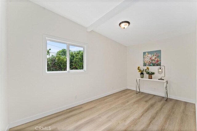 17924 E Kelby St, Covina, CA 91722 - unfurnished room featuring light wood finished floors and beam ceiling