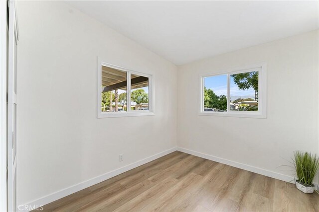 17924 E Kelby St, Covina, CA 91722 - spare room with light wood-type flooring and vaulted ceiling