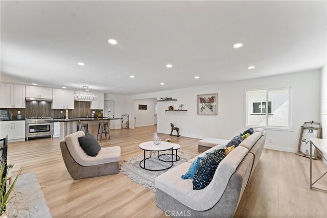 17924 E Kelby St, Covina, CA 91722 - living room featuring recessed lighting, light wood-style flooring, and baseboards