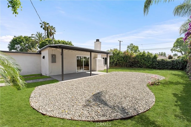 17924 E Kelby St, Covina, CA 91722 - back of house featuring a chimney, stucco siding, a patio, and a yard
