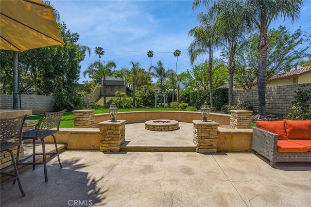 178 Grapevine Dr, Corona, CA 92882 - fenced backyard featuring a fire pit and a patio area