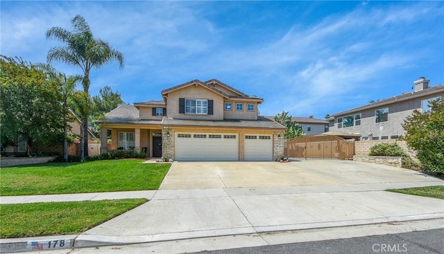 178 Grapevine Dr, Corona, CA 92882 - view of front of property with a garage, concrete driveway, stucco siding, and stone siding