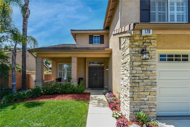 178 Grapevine Dr, Corona, CA 92882 - doorway to property with stone siding, stucco siding, and covered porch