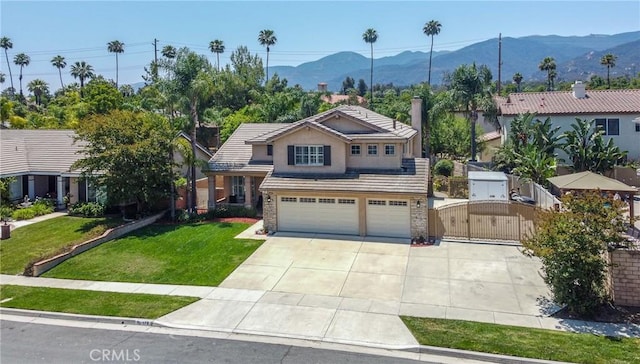 178 Grapevine Dr, Corona, CA 92882 - view of front of house with a gate, concrete driveway, a mountain view, and an attached garage