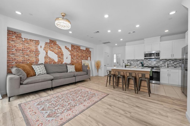 2141 Acara Cir, San Diego, CA 92154 - living room with light wood-style floors and recessed lighting