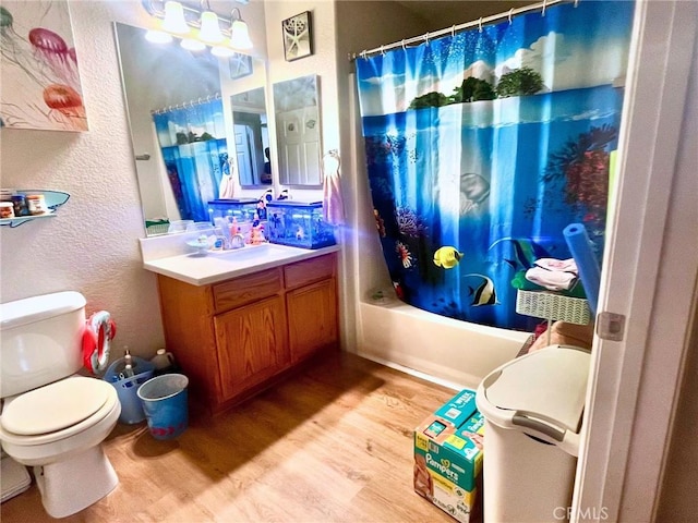 41410 Juniper St Unit 1513, Murrieta, CA 92562 - full bathroom featuring wood finished floors, a textured wall, vanity, and shower / bathtub combination with curtain