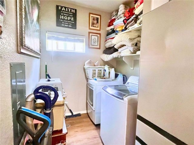 41410 Juniper St Unit 1513, Murrieta, CA 92562 - laundry area with washer and clothes dryer and light wood-type flooring