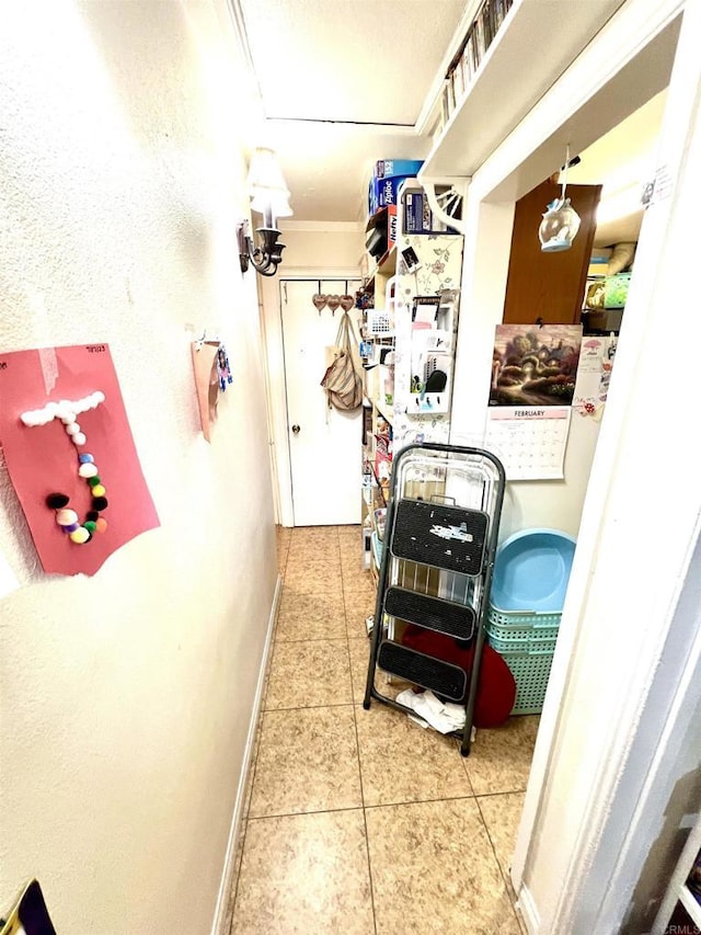 41624164 38th St, San Diego, CA 92105 - hall with tile patterned floors, baseboards, and ornamental molding