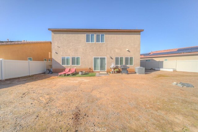 32593 Cumulus Ln, Winchester, CA 92596 - back of house with stucco siding, a fenced backyard, and central AC unit
