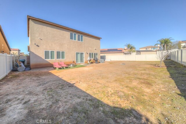 32593 Cumulus Ln, Winchester, CA 92596 - back of property with stucco siding and a fenced backyard