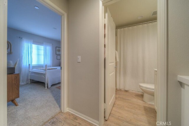 32593 Cumulus Ln, Winchester, CA 92596 - bathroom with toilet, wood finished floors, and a shower with curtain
