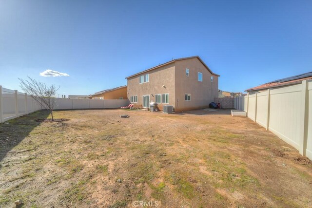 32593 Cumulus Ln, Winchester, CA 92596 - back of property featuring central AC, a fenced backyard, and stucco siding