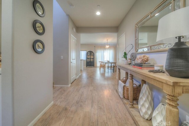 32593 Cumulus Ln, Winchester, CA 92596 - corridor featuring light wood-style flooring and baseboards