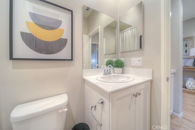 32593 Cumulus Ln, Winchester, CA 92596 - bathroom featuring toilet, vanity, and wood finished floors