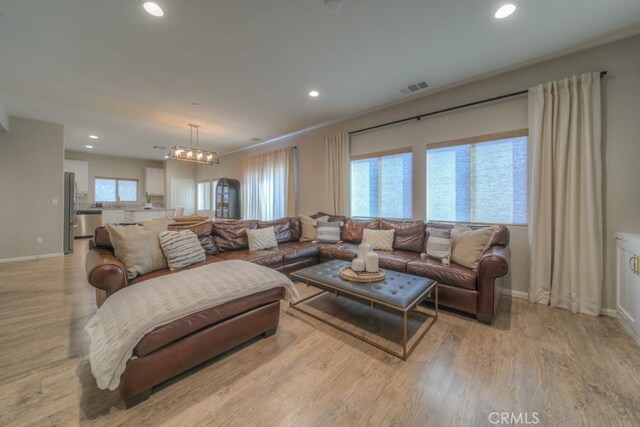 32593 Cumulus Ln, Winchester, CA 92596 - living room featuring light wood-style floors, baseboards, and recessed lighting