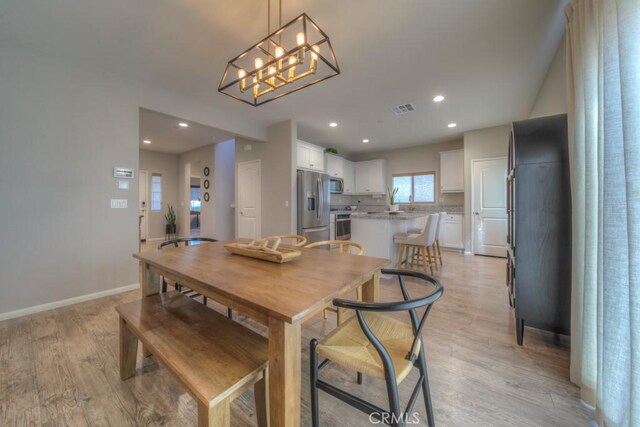 32593 Cumulus Ln, Winchester, CA 92596 - dining space with light wood finished floors, recessed lighting, baseboards, and a chandelier