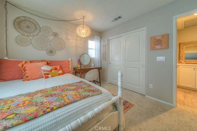 32593 Cumulus Ln, Winchester, CA 92596 - bedroom featuring light carpet, a closet, and baseboards