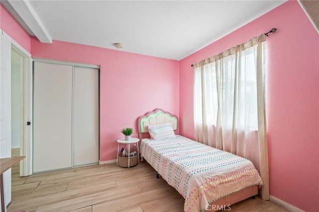 13492 Palomino Creek Dr, Corona, CA 92883 - bedroom with wood finished floors and a closet