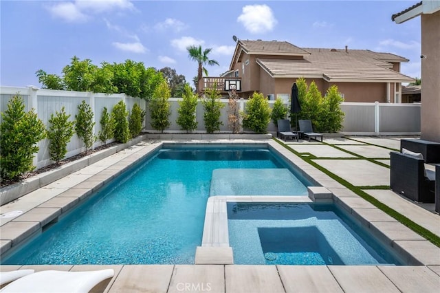 13492 Palomino Creek Dr, Corona, CA 92883 - view of pool featuring a fenced backyard, a patio, and a pool with connected hot tub