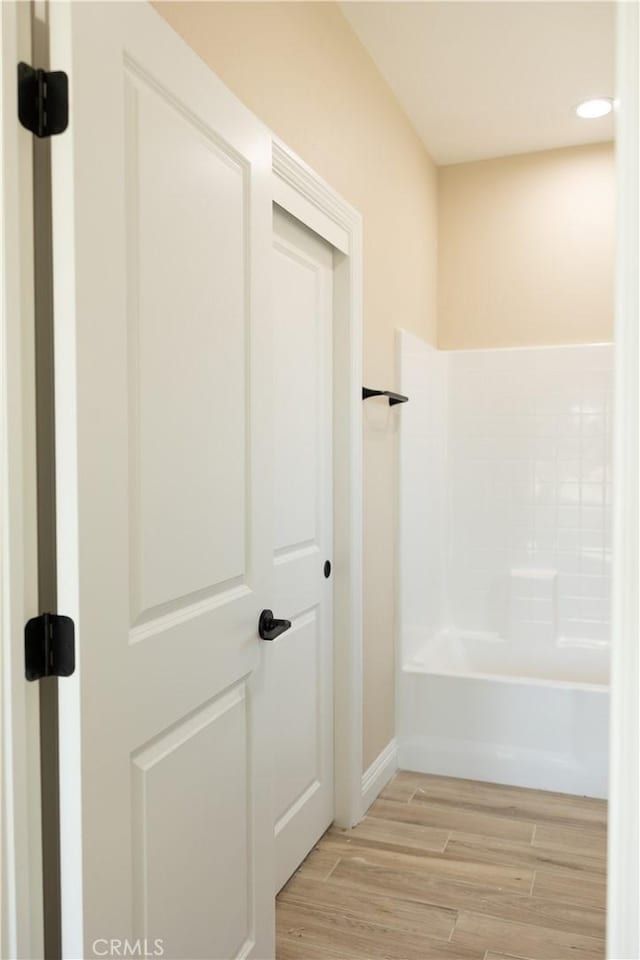 15640 Cheyenne Rd, Apple Valley, CA 92307 - bathroom featuring wood finished floors, a tub to relax in, and recessed lighting
