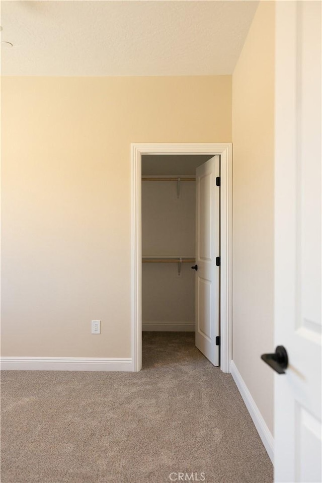 15640 Cheyenne Rd, Apple Valley, CA 92307 - unfurnished bedroom featuring carpet flooring, a spacious closet, and a closet