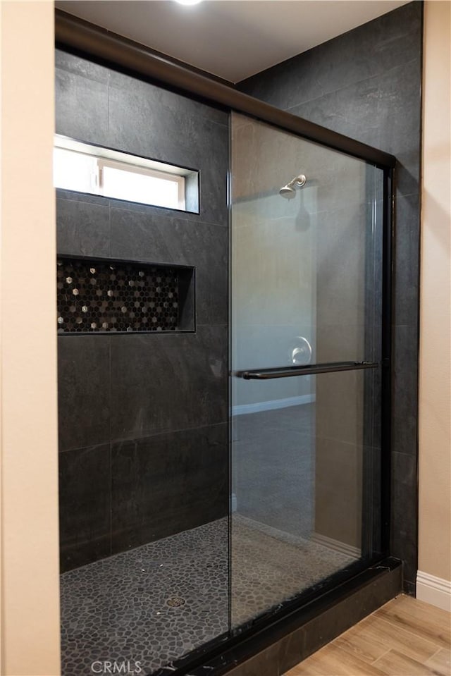 15640 Cheyenne Rd, Apple Valley, CA 92307 - bathroom featuring a shower stall and wood finished floors