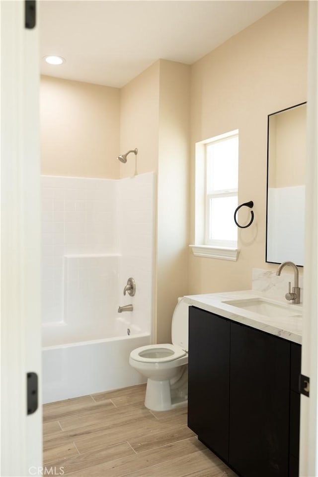 15640 Cheyenne Rd, Apple Valley, CA 92307 - full bathroom with vanity, washtub / shower combination, and wood finished floors