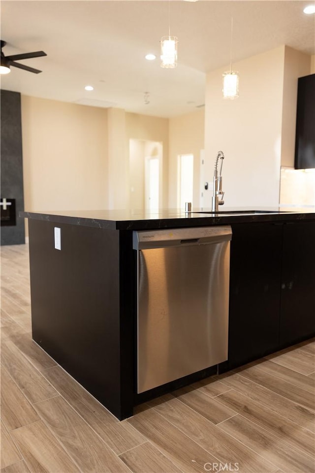 15640 Cheyenne Rd, Apple Valley, CA 92307 - kitchen featuring stainless steel dishwasher, light wood-type flooring, dark cabinetry, and recessed lighting