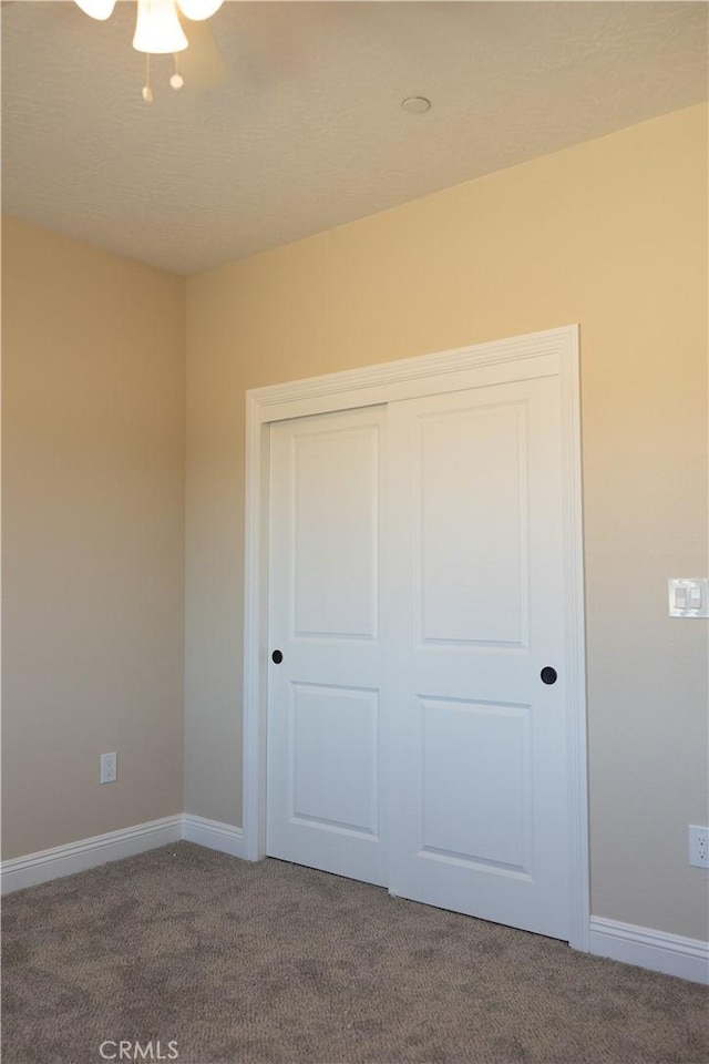 15640 Cheyenne Rd, Apple Valley, CA 92307 - unfurnished bedroom featuring dark carpet and a closet