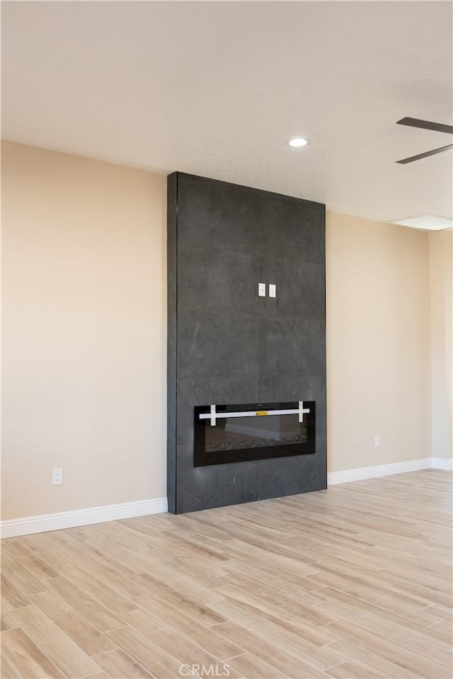 15640 Cheyenne Rd, Apple Valley, CA 92307 - detailed view of wood finished floors, a large fireplace, recessed lighting, and a ceiling fan