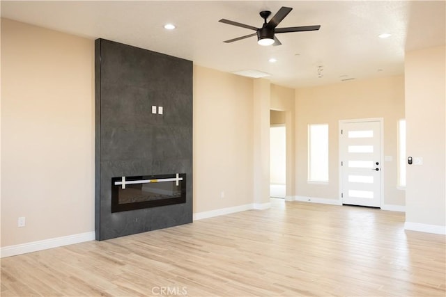 15640 Cheyenne Rd, Apple Valley, CA 92307 - unfurnished living room with light wood-style floors, a ceiling fan, recessed lighting, and a fireplace