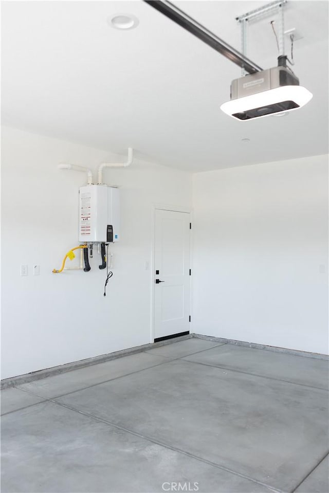 15640 Cheyenne Rd, Apple Valley, CA 92307 - garage featuring a garage door opener and tankless water heater