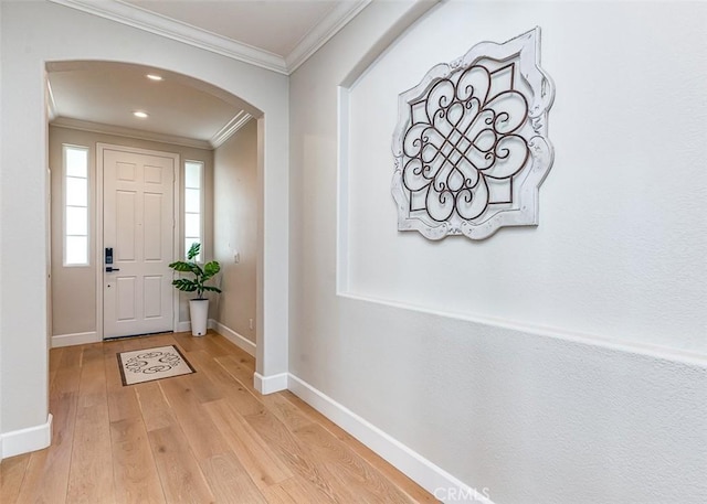 40365 Trenton Ct, Temecula, CA 92591 - foyer entrance featuring arched walkways, ornamental molding, light wood-type flooring, and recessed lighting