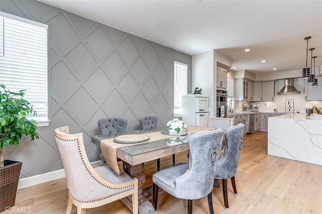 40365 Trenton Ct, Temecula, CA 92591 - dining room featuring a decorative wall, light wood finished floors, healthy amount of natural light, an accent wall, and recessed lighting