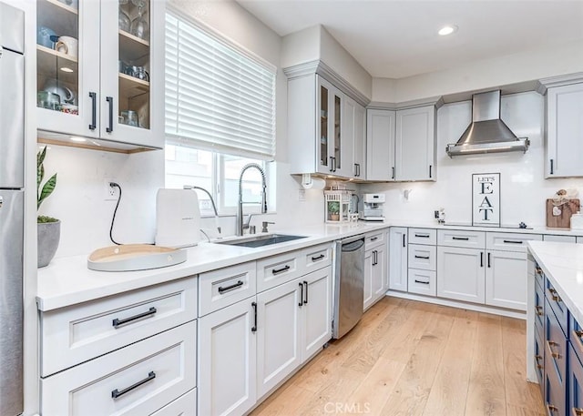 40365 Trenton Ct, Temecula, CA 92591 - kitchen featuring wall chimney exhaust hood, appliances with stainless steel finishes, light wood-style flooring, light countertops, and recessed lighting