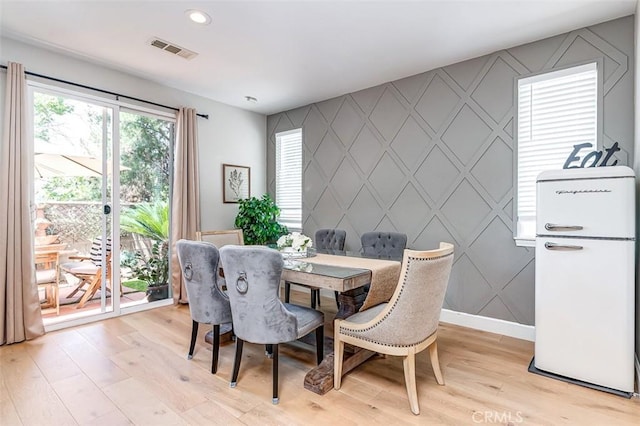 40365 Trenton Ct, Temecula, CA 92591 - dining space featuring an accent wall, a decorative wall, light wood-type flooring, and recessed lighting