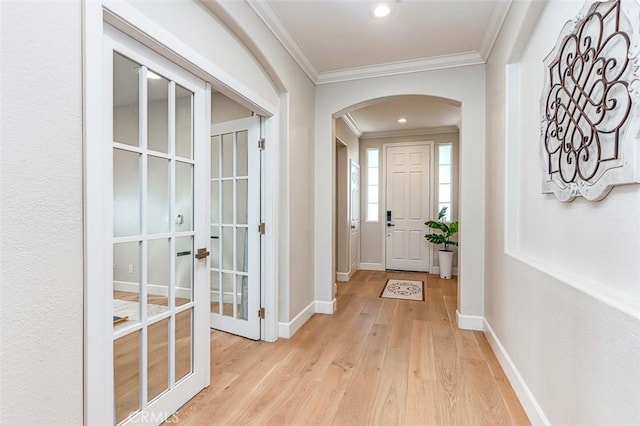 40365 Trenton Ct, Temecula, CA 92591 - entrance foyer with arched walkways, crown molding, light wood-style floors, and recessed lighting