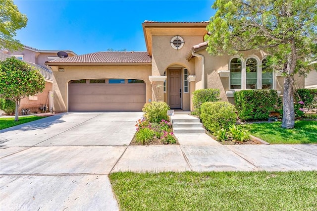 40365 Trenton Ct, Temecula, CA 92591 - mediterranean / spanish-style house with stucco siding, a garage, a tile roof, and driveway