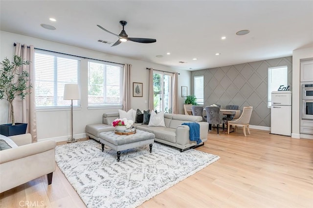 40365 Trenton Ct, Temecula, CA 92591 - living area featuring light wood finished floors, ceiling fan, recessed lighting, and an accent wall