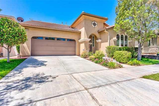 40365 Trenton Ct, Temecula, CA 92591 - mediterranean / spanish home featuring stucco siding, an attached garage, a tile roof, and driveway