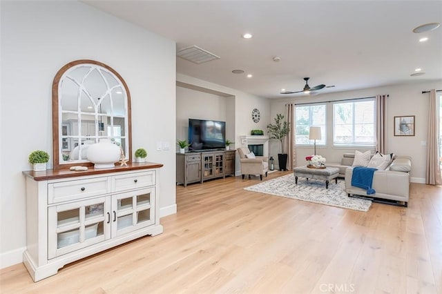 40365 Trenton Ct, Temecula, CA 92591 - living room with light wood-style floors, recessed lighting, ceiling fan, and a fireplace