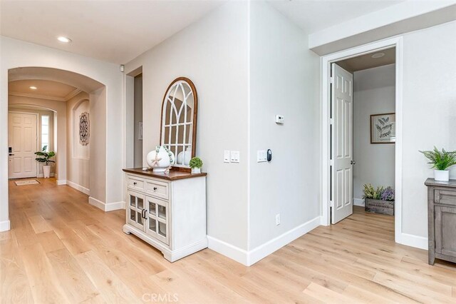 40365 Trenton Ct, Temecula, CA 92591 - corridor featuring light wood-style floors, arched walkways, and recessed lighting