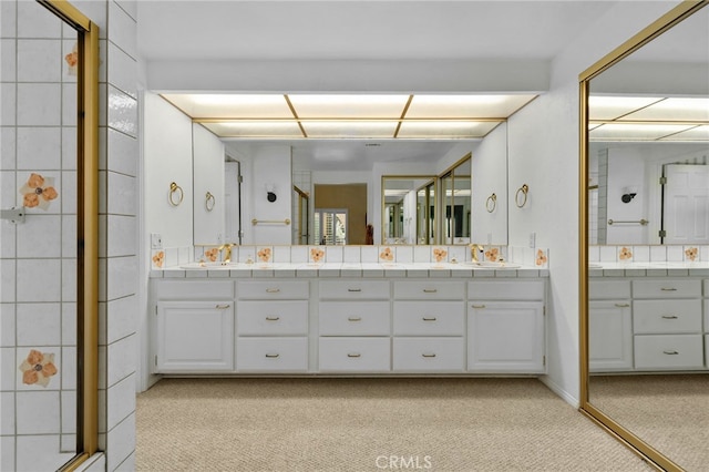 4527 Mockingbird Ln, Banning, CA 92220 - bathroom featuring double vanity and a shower with door