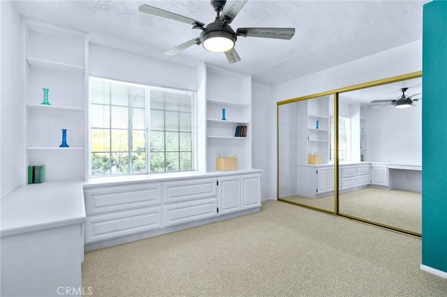 4527 Mockingbird Ln, Banning, CA 92220 - unfurnished bedroom featuring light carpet, a closet, and ceiling fan