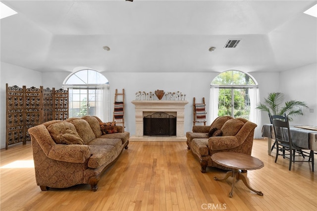 4527 Mockingbird Ln, Banning, CA 92220 - living room featuring light wood-style floors and a premium fireplace